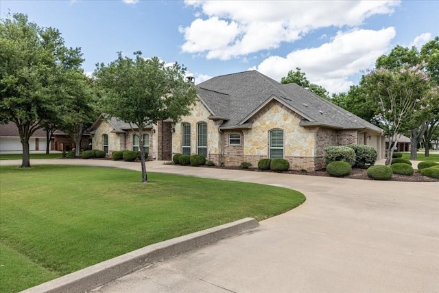 french country home with a front yard