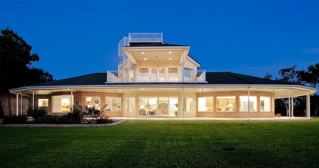 back of house with a yard, a balcony, and a patio area