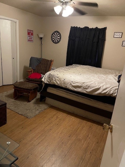 bedroom featuring ceiling fan and wood finished floors