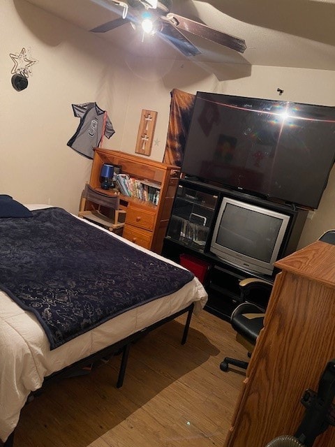 bedroom featuring ceiling fan and wood finished floors