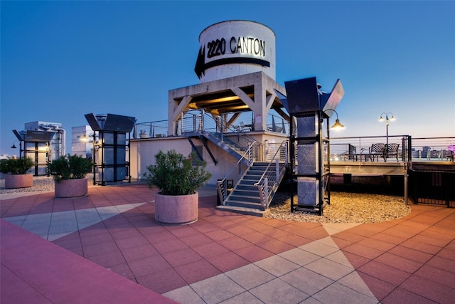 view of patio terrace at dusk