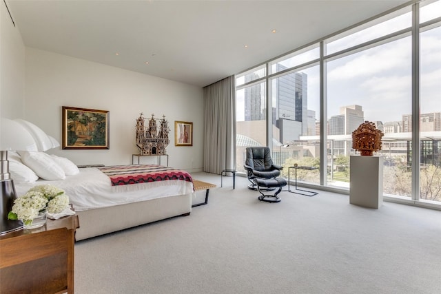 carpeted bedroom featuring floor to ceiling windows