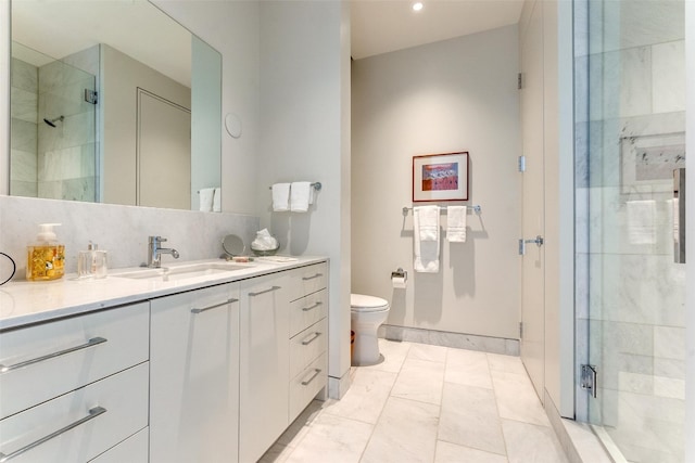 bathroom with tile floors, toilet, vanity, and an enclosed shower