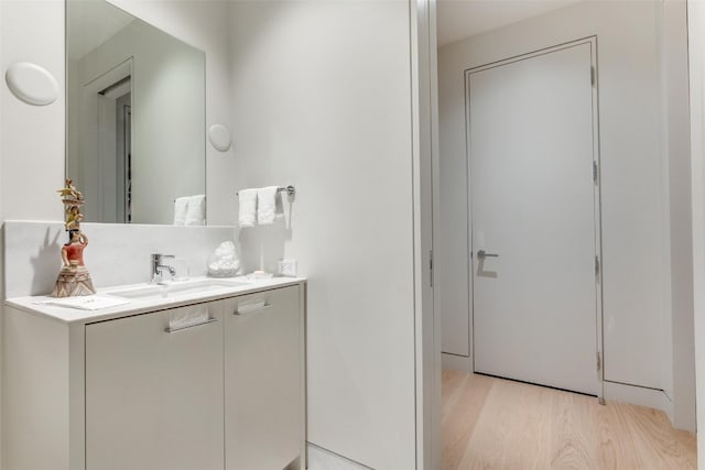 bathroom with vanity and hardwood / wood-style floors