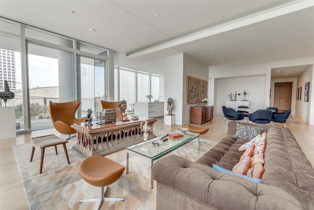 living room featuring expansive windows and a healthy amount of sunlight