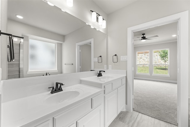 bathroom with ceiling fan and vanity