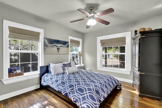 bedroom featuring ceiling fan and dark hardwood / wood-style floors