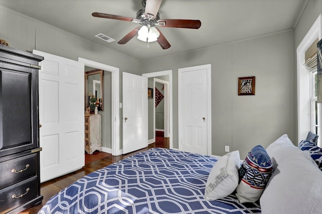 bedroom with ceiling fan and dark hardwood / wood-style flooring