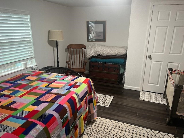 bedroom with hardwood / wood-style floors