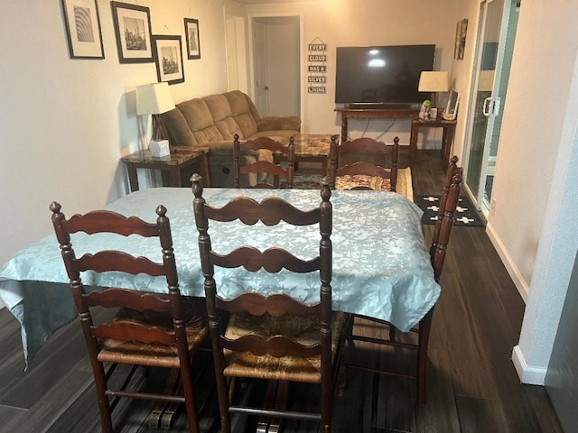 dining area featuring dark hardwood / wood-style floors