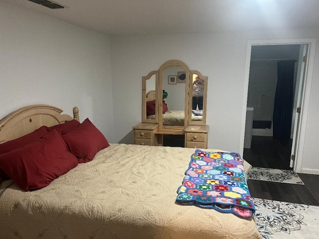 bedroom featuring dark hardwood / wood-style floors