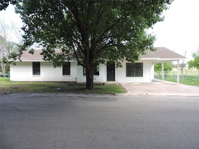 single story home with a carport