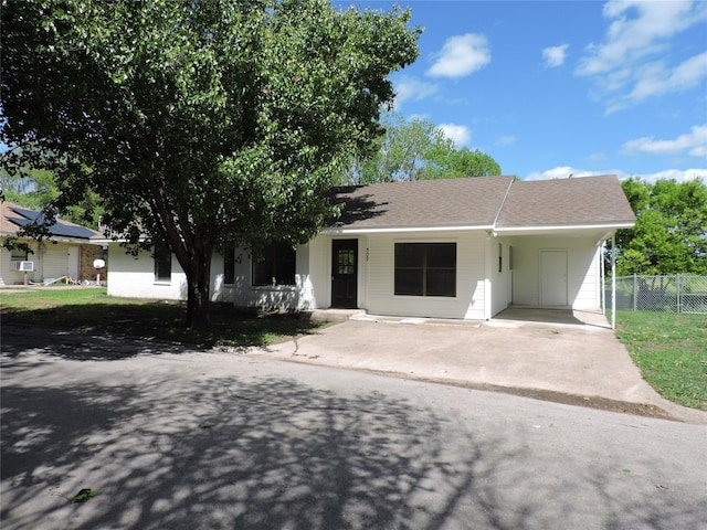 view of front of property with a carport