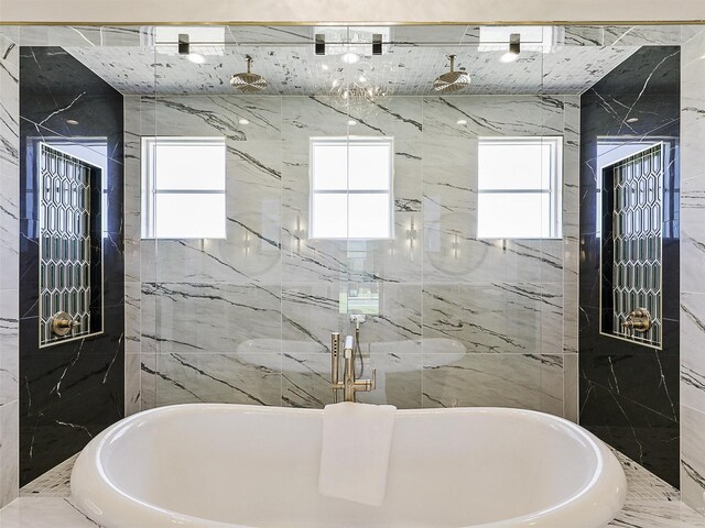 bathroom featuring tile walls and shower with separate bathtub