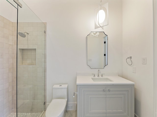 bathroom featuring walk in shower, vanity, and toilet