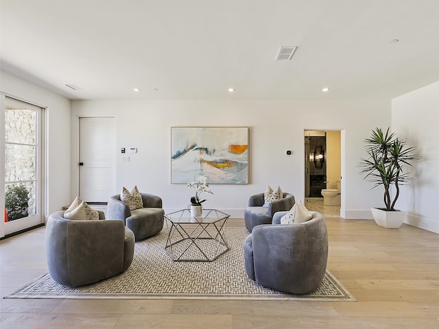 living room with light hardwood / wood-style floors