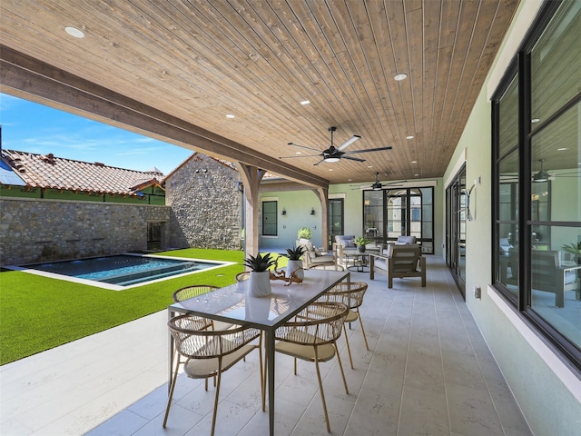 view of patio / terrace featuring an outdoor living space and ceiling fan