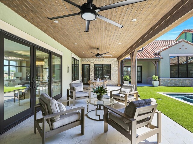 view of patio with an outdoor hangout area and ceiling fan