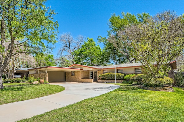 single story home featuring a carport and a front lawn