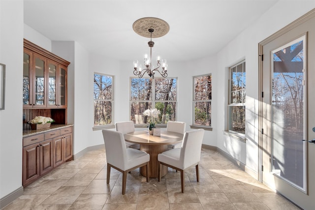 dining space featuring an inviting chandelier