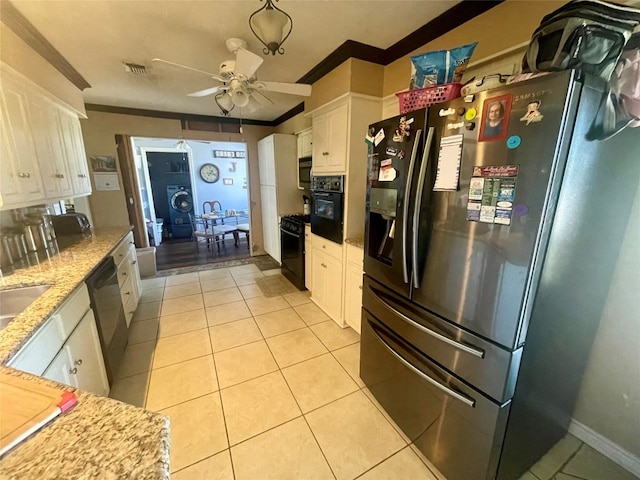 kitchen featuring ceiling fan, ornamental molding, white cabinets, light stone countertops, and black appliances