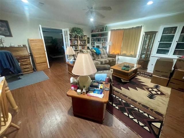 living room featuring ceiling fan, crown molding, and dark hardwood / wood-style floors