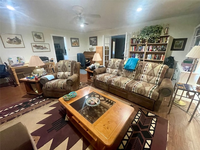 living room with ceiling fan and light wood-type flooring