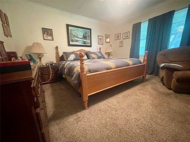 carpeted bedroom featuring crown molding