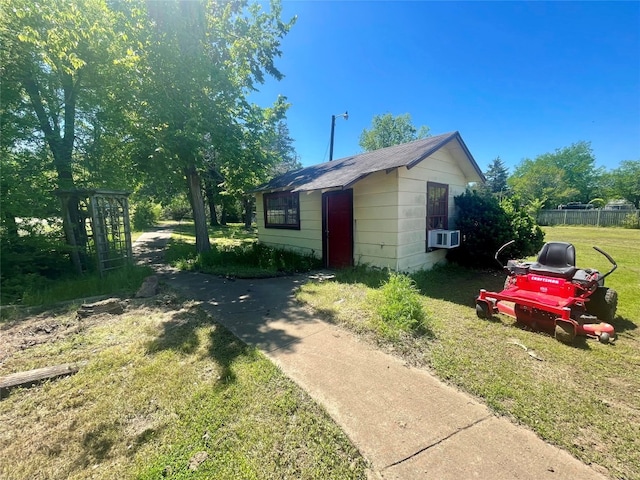 view of side of home featuring a yard