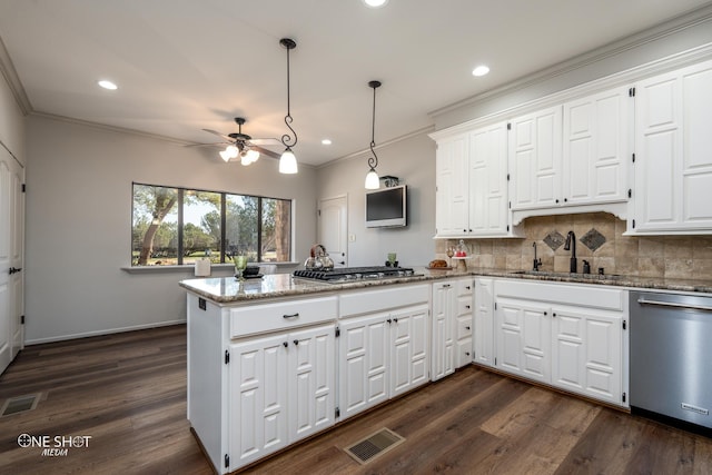 kitchen featuring kitchen peninsula, white cabinetry, sink, and stainless steel appliances