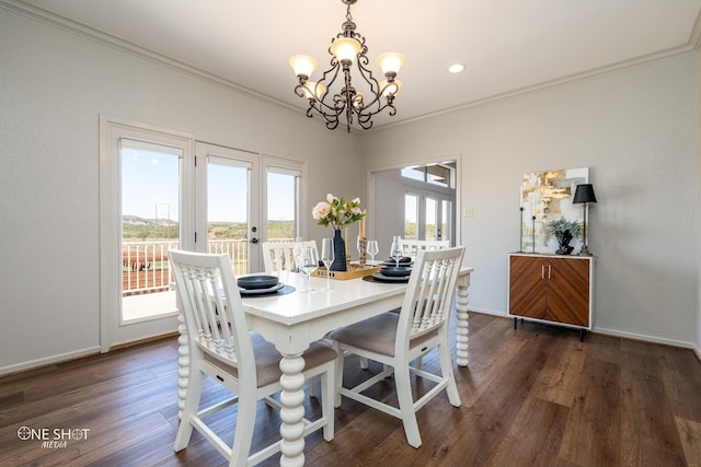 dining area featuring a notable chandelier, dark hardwood / wood-style floors, crown molding, and french doors