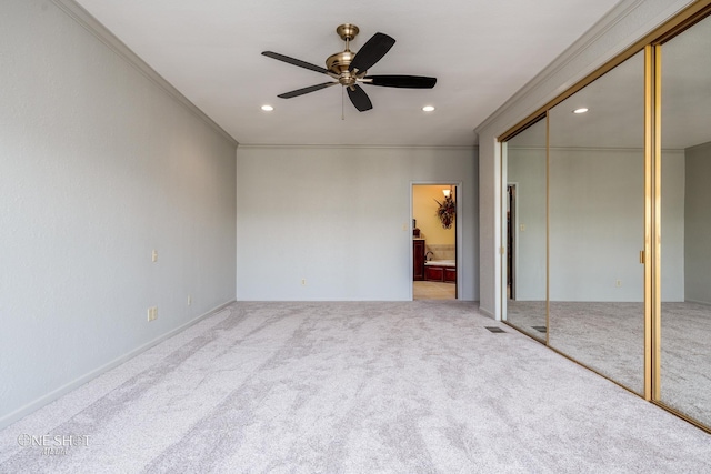 unfurnished bedroom with carpet floors, ceiling fan, and ornamental molding