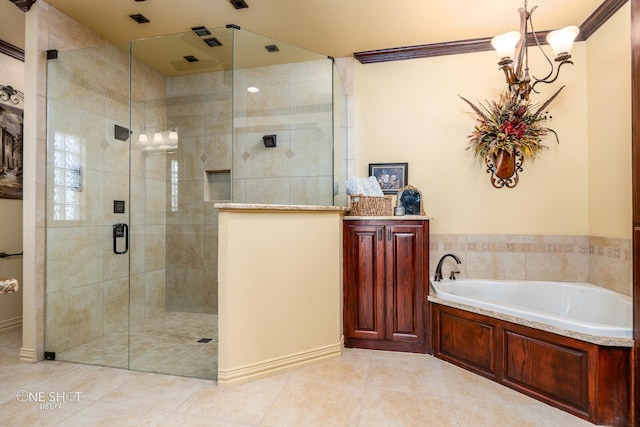 bathroom with tile patterned floors and shower with separate bathtub