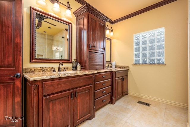 bathroom with vanity, tile patterned floors, and ornamental molding