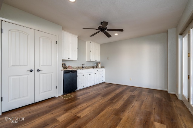 kitchen with dishwasher, dark hardwood / wood-style flooring, white cabinets, and sink