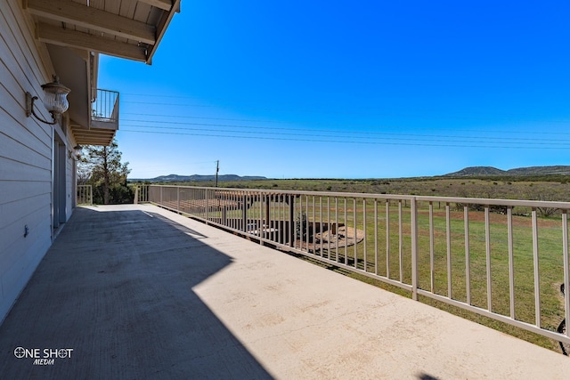 view of patio with a mountain view and a rural view