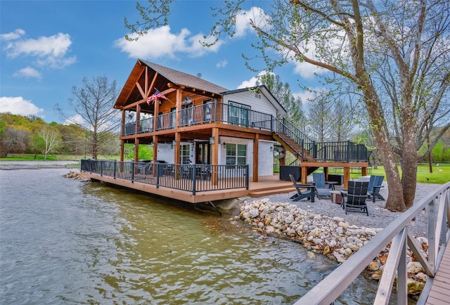 view of dock featuring a deck with water view