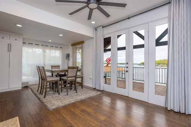 dining area with dark hardwood / wood-style floors, ceiling fan, and french doors