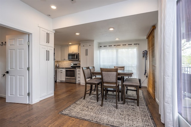 dining room featuring dark hardwood / wood-style flooring