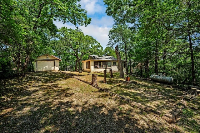 68 Zumwalt Ln, Pottsboro, TX 75076 - view of yard featuring a garage and an outdoor structure