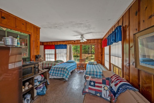 68 Zumwalt Ln, Pottsboro, TX 75076 - bedroom with wood walls and a ceiling fan