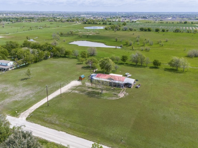 drone / aerial view with a rural view and a water view