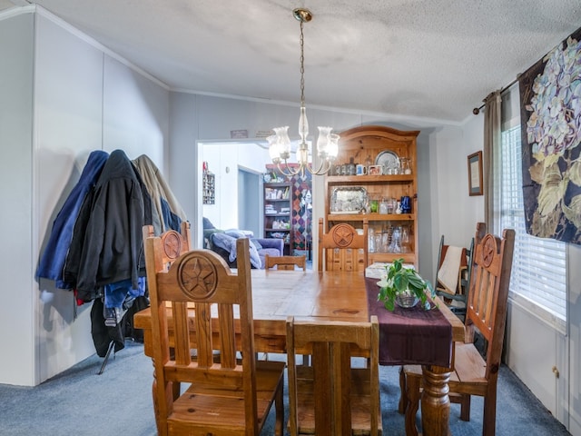 dining space with crown molding, an inviting chandelier, a textured ceiling, and dark carpet