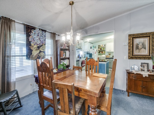 dining space with an inviting chandelier, dark carpet, lofted ceiling, a textured ceiling, and crown molding