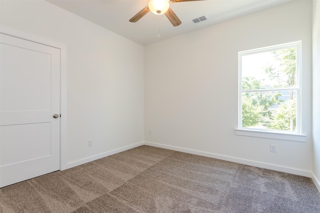 spare room with carpet and ceiling fan