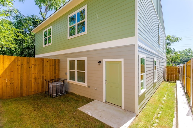 rear view of property featuring a yard