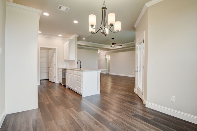 kitchen featuring pendant lighting, ornamental molding, white cabinetry, dark hardwood / wood-style floors, and ceiling fan with notable chandelier