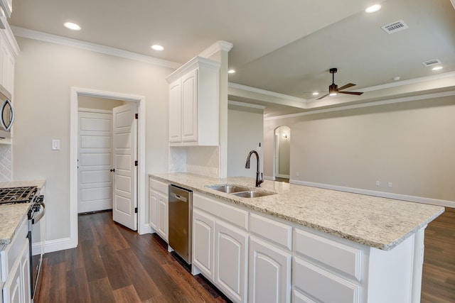 kitchen with dark wood-type flooring, sink, white cabinets, stainless steel appliances, and ornamental molding