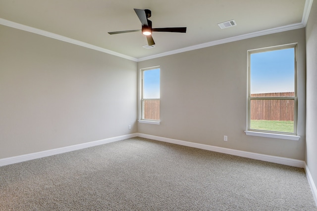 carpeted spare room with ornamental molding and ceiling fan