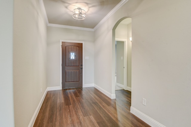 foyer entrance featuring ornamental molding and dark hardwood / wood-style flooring